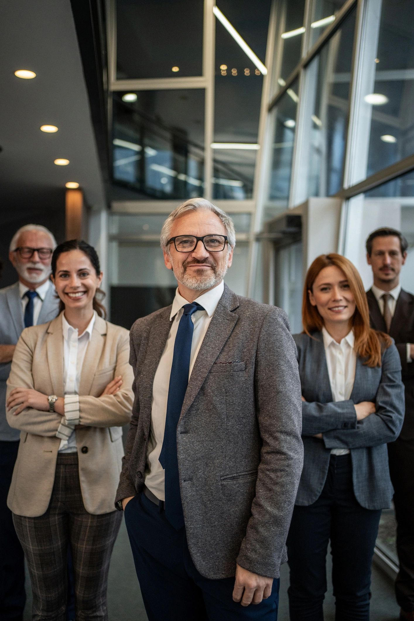 Professional business team posing in modern office